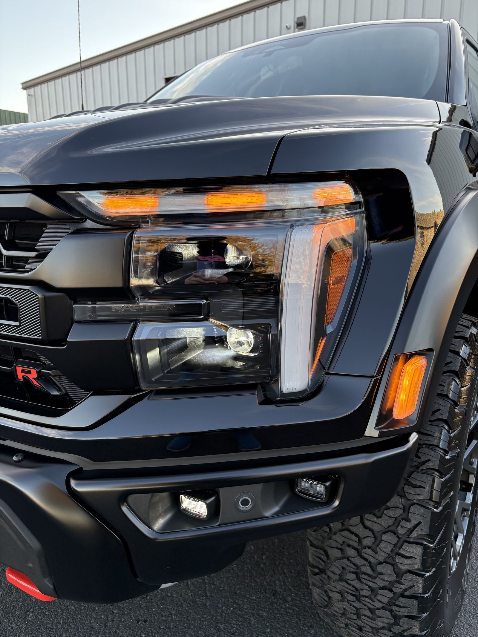 Black Ford Raptor front end protected with film and coating at 630 Detailing in Oswego, Illinois